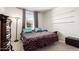 Cozy bedroom with a comfortable day bed, natural light, and stylish decor at 10625 S 55Th Dr, Laveen, AZ 85339