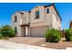 Lovely two-story home with brick driveway, two-car garage, desert landscaping, and covered entry at 10625 S 55Th Dr, Laveen, AZ 85339