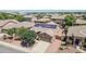 Stunning aerial view of this home with solar panels with a well-manicured lawn at 11318 W Monte Vista Rd, Avondale, AZ 85392