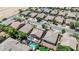 An aerial view showcases a neighborhood with pools and well-maintained landscaping at 11318 W Monte Vista Rd, Avondale, AZ 85392