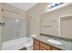 Bathroom with granite vanity, bathtub with shower, and vinyl floor at 11318 W Monte Vista Rd, Avondale, AZ 85392