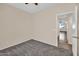 Neutral bedroom featuring carpet flooring, ceiling fan, and an open doorway at 11318 W Monte Vista Rd, Avondale, AZ 85392