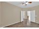 Bedroom featuring a ceiling fan and a view to the hallway and living area at 11318 W Monte Vista Rd, Avondale, AZ 85392