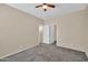 Inviting bedroom with neutral paint, carpet, and view of the hallway through doorways at 11318 W Monte Vista Rd, Avondale, AZ 85392