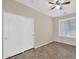 Bedroom featuring a closet, a window, and vinyl floors at 11318 W Monte Vista Rd, Avondale, AZ 85392