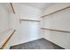 A walk-in closet with multiple shelves and rods for ample storage at 11318 W Monte Vista Rd, Avondale, AZ 85392
