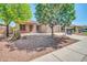 Charming single-Gathering home with desert landscaping, mature trees, and a two-car garage at 11318 W Monte Vista Rd, Avondale, AZ 85392