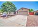 Charming single-Gathering home with desert landscaping, mature trees, and a two-car garage at 11318 W Monte Vista Rd, Avondale, AZ 85392