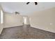 Spacious living room with neutral paint, and a ceiling fan at 11318 W Monte Vista Rd, Avondale, AZ 85392