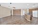 The living room with its open layout flows to the island kitchen creating a great gathering space at 11318 W Monte Vista Rd, Avondale, AZ 85392