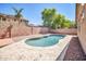 Backyard featuring an in-ground pool with a brick perimeter fence at 11318 W Monte Vista Rd, Avondale, AZ 85392