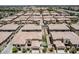 An aerial view captures a meticulously planned community featuring well-manicured lawns and thoughtfully designed homes at 1367 S Country Club Dr # 1331, Mesa, AZ 85210