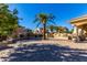 An expansive outdoor patio with a fireplace, grill, and bar area offer ample space for outdoor entertaining at 1367 S Country Club Dr # 1331, Mesa, AZ 85210