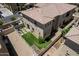 Aerial view of a home featuring an outdoor dining set, artificial turf, and a fenced backyard with desert landscaping at 1367 S Country Club Dr # 1331, Mesa, AZ 85210