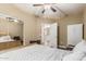 Comfortable bedroom features a ceiling fan, closet with mirrored doors and neutral colored walls at 1367 S Country Club Dr # 1331, Mesa, AZ 85210