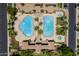 Community pool features multiple pools, a spa, palm trees, and ample lounge seating for a resort-like experience at 1367 S Country Club Dr # 1331, Mesa, AZ 85210