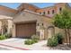 Exterior shot of a home with a private gate and a two car garage at 1367 S Country Club Dr # 1331, Mesa, AZ 85210