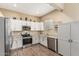 Modern kitchen featuring stainless appliances, white cabinetry and granite countertops at 1367 S Country Club Dr # 1331, Mesa, AZ 85210
