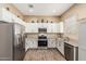 Bright kitchen with granite counters, stainless appliances, and white cabinetry at 1367 S Country Club Dr # 1331, Mesa, AZ 85210