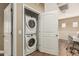 Conveniently stacked washer and dryer units in a closet on the upper level at 1367 S Country Club Dr # 1331, Mesa, AZ 85210