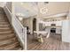 Spacious living room featuring staircase, chandelier, dining area and kitchen at 1367 S Country Club Dr # 1331, Mesa, AZ 85210