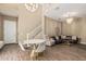 Open-concept room featuring living room, dining area, staircase and chandelier at 1367 S Country Club Dr # 1331, Mesa, AZ 85210