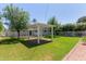 Backyard featuring mature trees, a pergola, lawn and privacy fence at 152 W 2Nd St, Mesa, AZ 85201