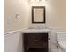 Bathroom featuring dark vanity with marble countertop, toilet and paneled walls at 152 W 2Nd St, Mesa, AZ 85201