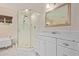 Elegant bathroom showcasing glass shower, marble floors, white vanity, and claw foot tub for a luxurious retreat at 152 W 2Nd St, Mesa, AZ 85201