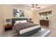 Comfortable bedroom with ceiling fan, stylish decor, carpet flooring, and two windows at 152 W 2Nd St, Mesa, AZ 85201