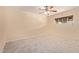 Large bedroom features neutral paint, carpet flooring, a ceiling fan, and one window at 152 W 2Nd St, Mesa, AZ 85201