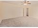 Spacious bedroom features a ceiling fan, neutral paint, carpet flooring, and a double door closet at 152 W 2Nd St, Mesa, AZ 85201