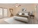 This primary bedroom features french doors, a ceiling fan, and neutral decor at 152 W 2Nd St, Mesa, AZ 85201
