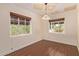 Dining room featuring wood floors, crown molding, and ample natural light from the windows at 152 W 2Nd St, Mesa, AZ 85201