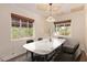 Bright dining room featuring a marble table, modern lighting, and a decorative ceiling at 152 W 2Nd St, Mesa, AZ 85201
