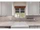 Close up of sink showing the window and backsplash at 152 W 2Nd St, Mesa, AZ 85201