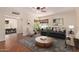 Inviting living room featuring hardwood floors, a ceiling fan, and an abundance of natural light at 152 W 2Nd St, Mesa, AZ 85201