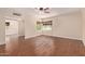 A spacious living room with sleek wood floors and ample natural light from the windows at 152 W 2Nd St, Mesa, AZ 85201