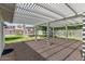 Brick patio covered by wooden pergola in backyard at 152 W 2Nd St, Mesa, AZ 85201