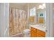 Bathroom with a shower-tub combination, a single sink vanity, and neutral-colored decor at 15314 W Pantano Dr, Surprise, AZ 85374