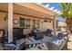 Covered patio with outdoor seating, ceiling fan, and grill at 15314 W Pantano Dr, Surprise, AZ 85374