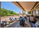 Comfortable covered patio featuring stylish outdoor furniture with blue cushions at 15314 W Pantano Dr, Surprise, AZ 85374
