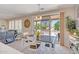 Bright dining area with a sliding glass door leading to an outdoor patio at 15314 W Pantano Dr, Surprise, AZ 85374