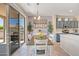 Open dining area with a slider that lets in natural light, next to the kitchen at 15314 W Pantano Dr, Surprise, AZ 85374