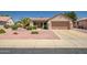 Charming single-story home featuring desert landscaping and a two-car garage at 15314 W Pantano Dr, Surprise, AZ 85374