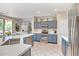 Well-lit kitchen featuring stainless steel appliances and a functional layout at 15314 W Pantano Dr, Surprise, AZ 85374