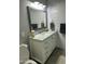 Bright bathroom with a white vanity, elegant mirror, and modern fixtures at 1734 W Tuckey Ln # 14, Phoenix, AZ 85015