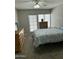 Comfortable bedroom with wood furnishings, ample natural light, and a relaxing atmosphere at 1734 W Tuckey Ln # 14, Phoenix, AZ 85015