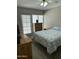 Cozy bedroom with a full bed, neutral tones, and natural light from a large window at 1734 W Tuckey Ln # 14, Phoenix, AZ 85015