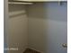 Empty closet features minimal design and neutral walls for flexible storage solutions at 1734 W Tuckey Ln # 14, Phoenix, AZ 85015